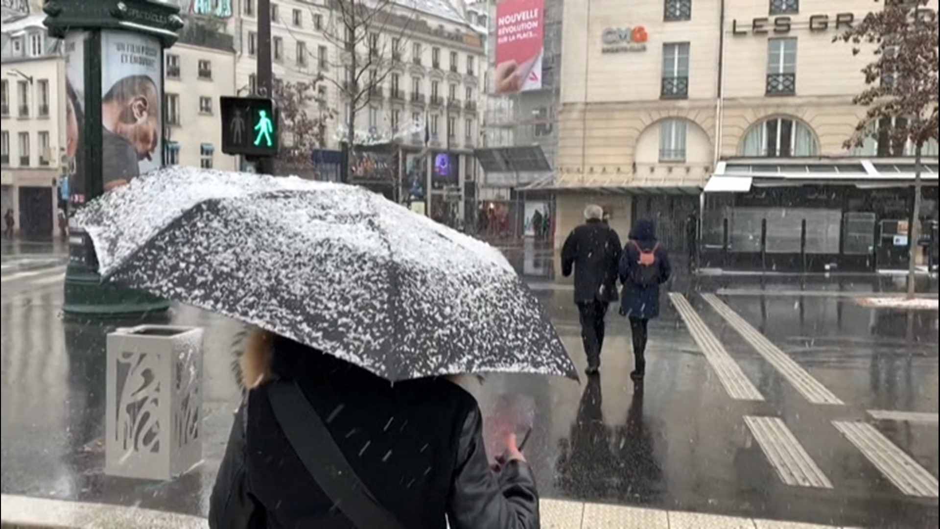 Snow falls across Paris, France, on Jan. 16, while 32 departments in the country are under an orange alert for snow and ice.
