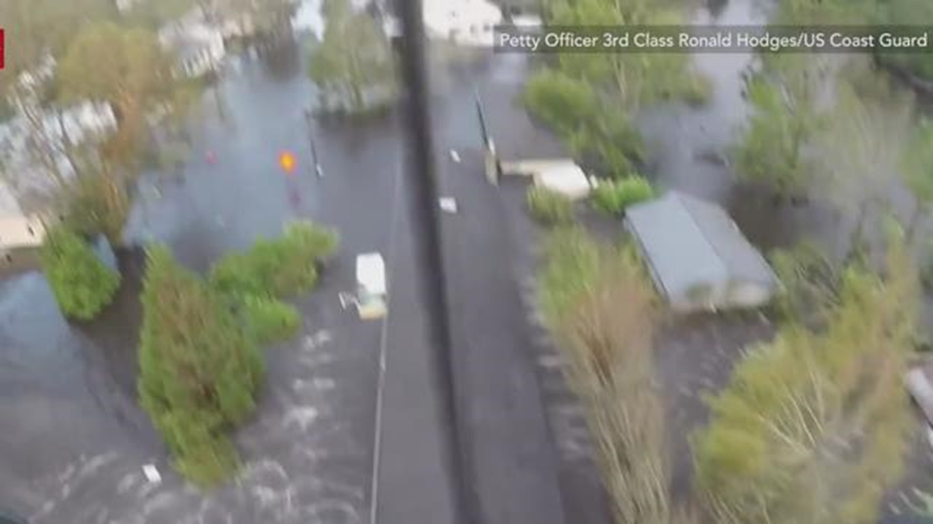 The US Coast Guard rescued a man and his dog from severe flooding near Wilmington, North Carolina, on September 17, in the wake of Hurricane Florence.