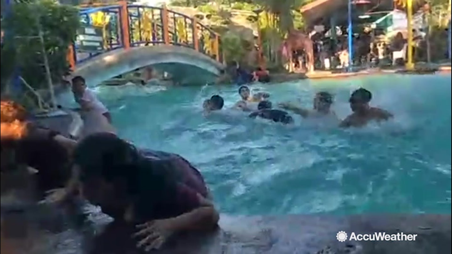 Earthquake causes chaos in swimming pool as kids frantically try to get ...