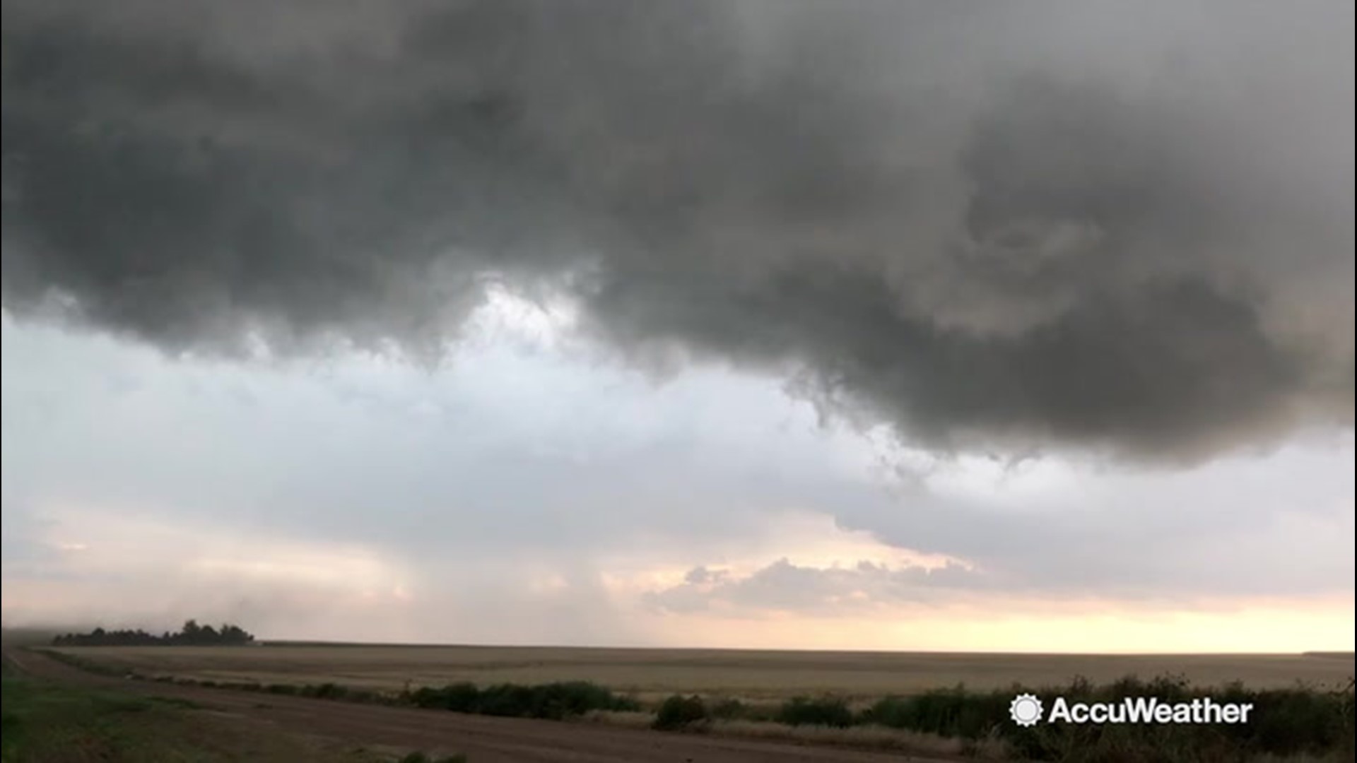 This dark funnel cloud was spotted looming ominously over a field in Bethune, Colorado, on Aug. 13.  The video was recorded by storm chaser Reed Timmer.