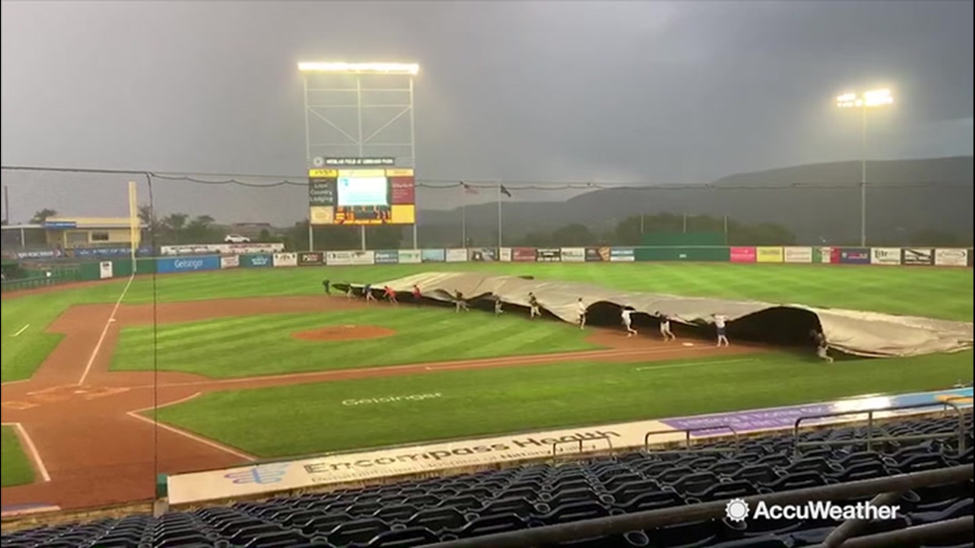 Wet weather brings baseball grounds crew mishaps, ballplayers fun