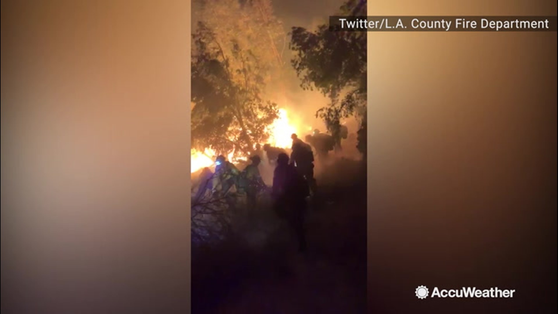 Strong Santa Ana winds proved challenging for firefighters as they went all-out to clear brush to try to impede the growth of the rapidly growing blaze on Oct. 11.