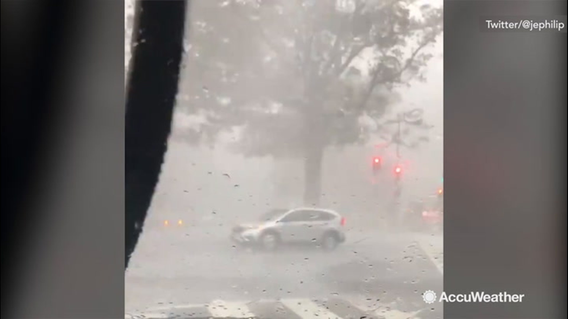 An umbrella was blown down the street by a storm in Washington, D.C., on Aug. 20, nearly hitting cars.