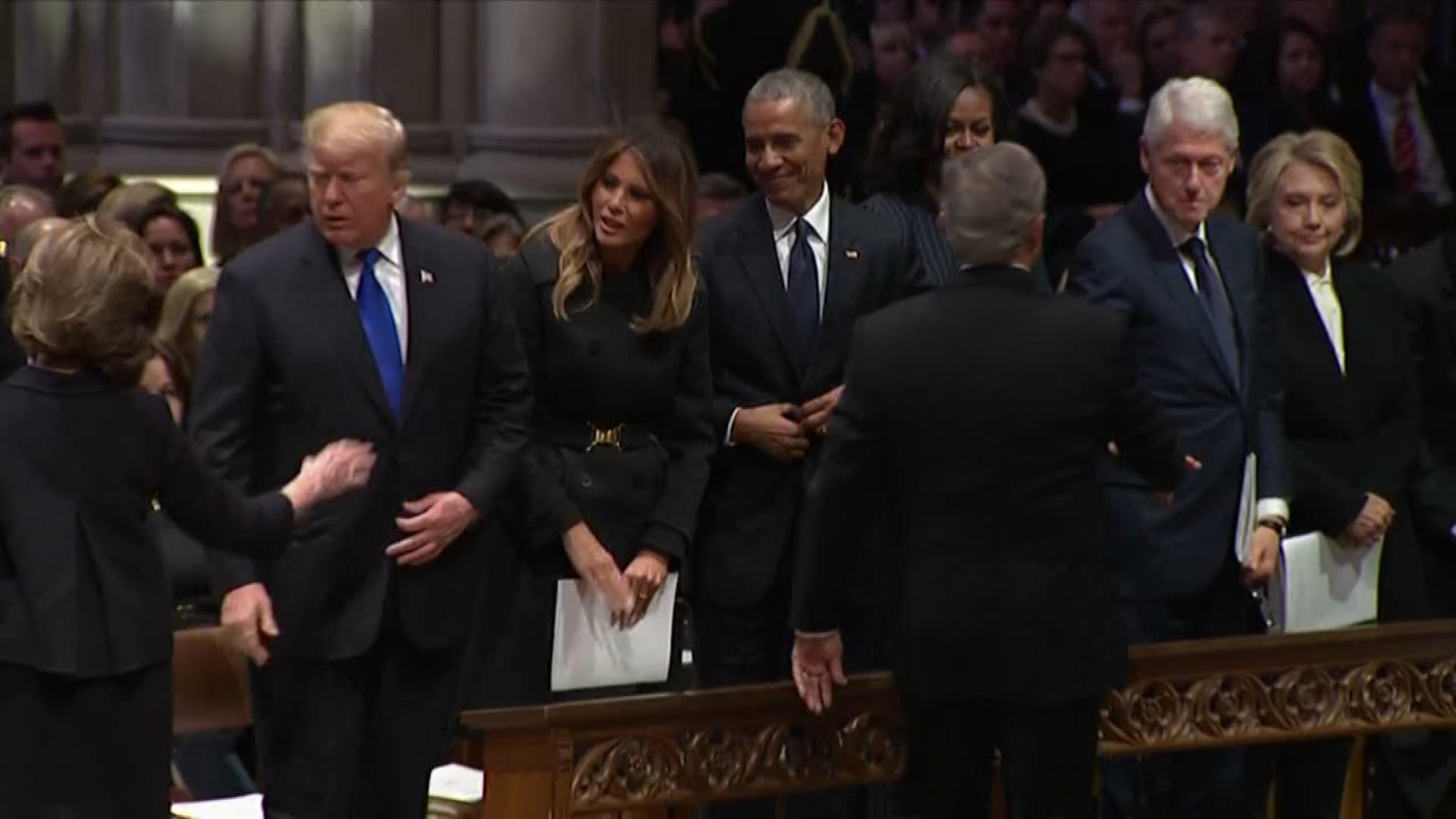 George W. Bush greets fellow presidents gives Michelle Obama candy