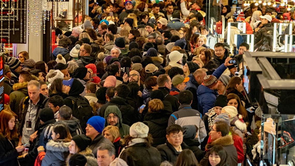 Virus keeps Black Friday crowds thin, shoppers shift online