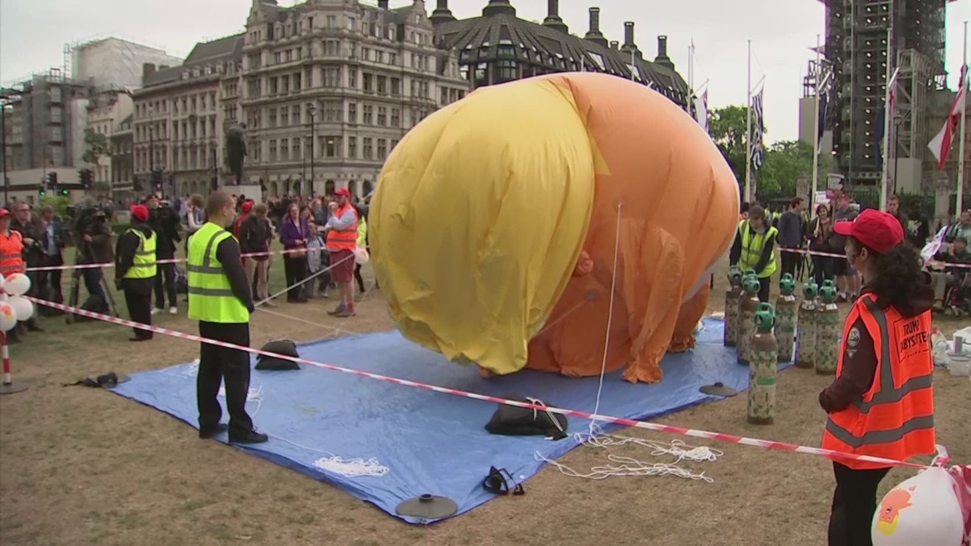 The 'Trump Baby' blimp is inflated in central London as people start to gather to demonstrate against the state visit of President Donald Trump. (AP)