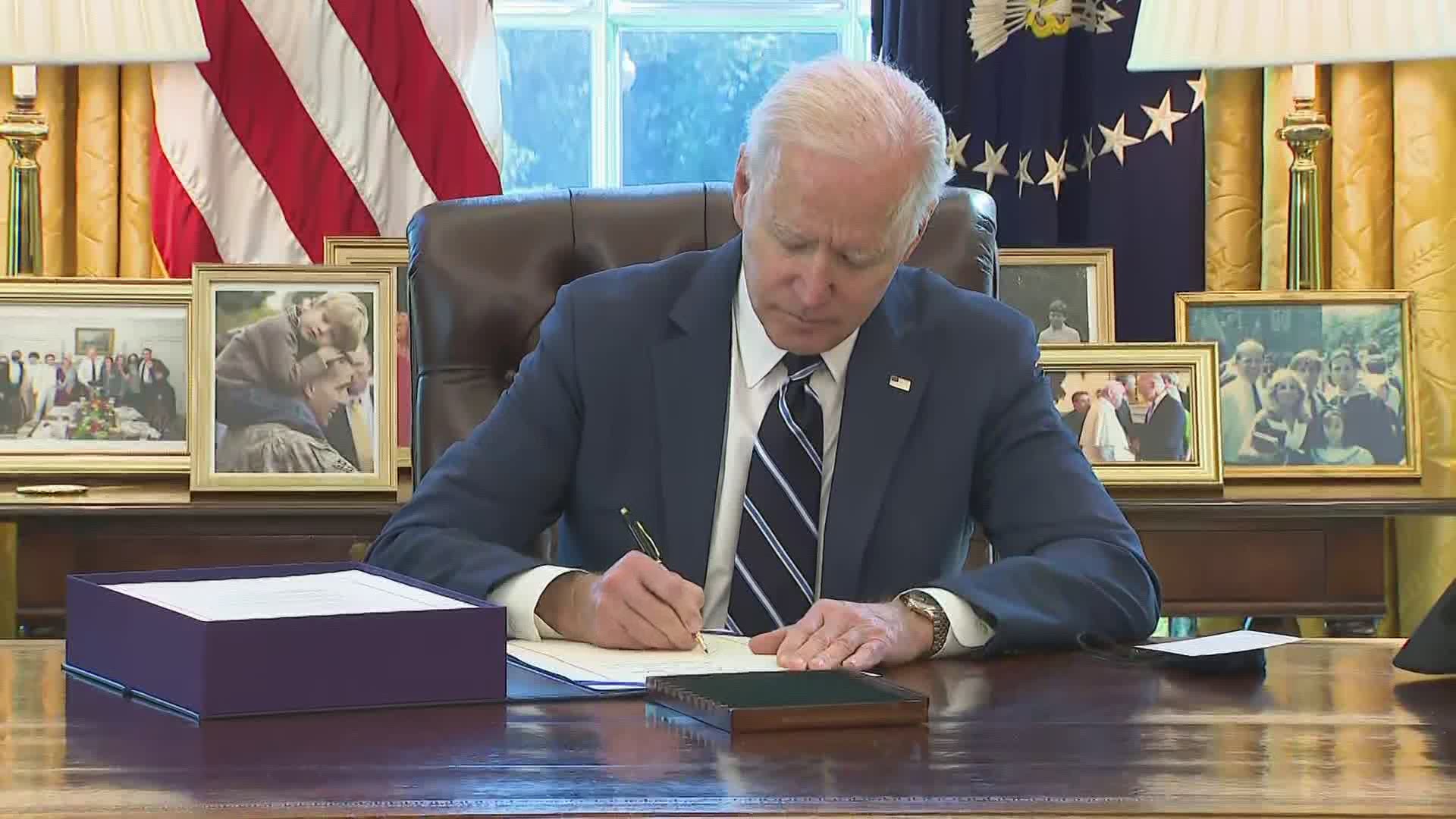 President Joe Biden signed the $1.9 trillion coronavirus relief bill in the oval office Thursday.