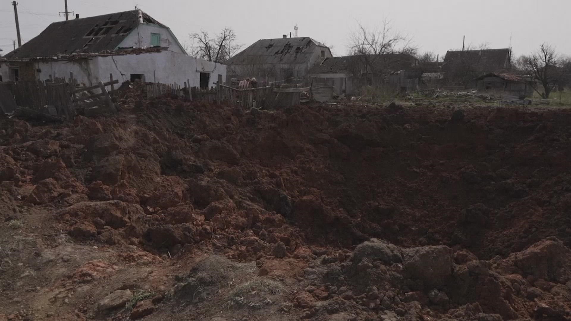 A bomb hit Ukraine's Mykolaiv District Tuesday. Nobody was killed, but the blast left a huge crater and damaged houses.