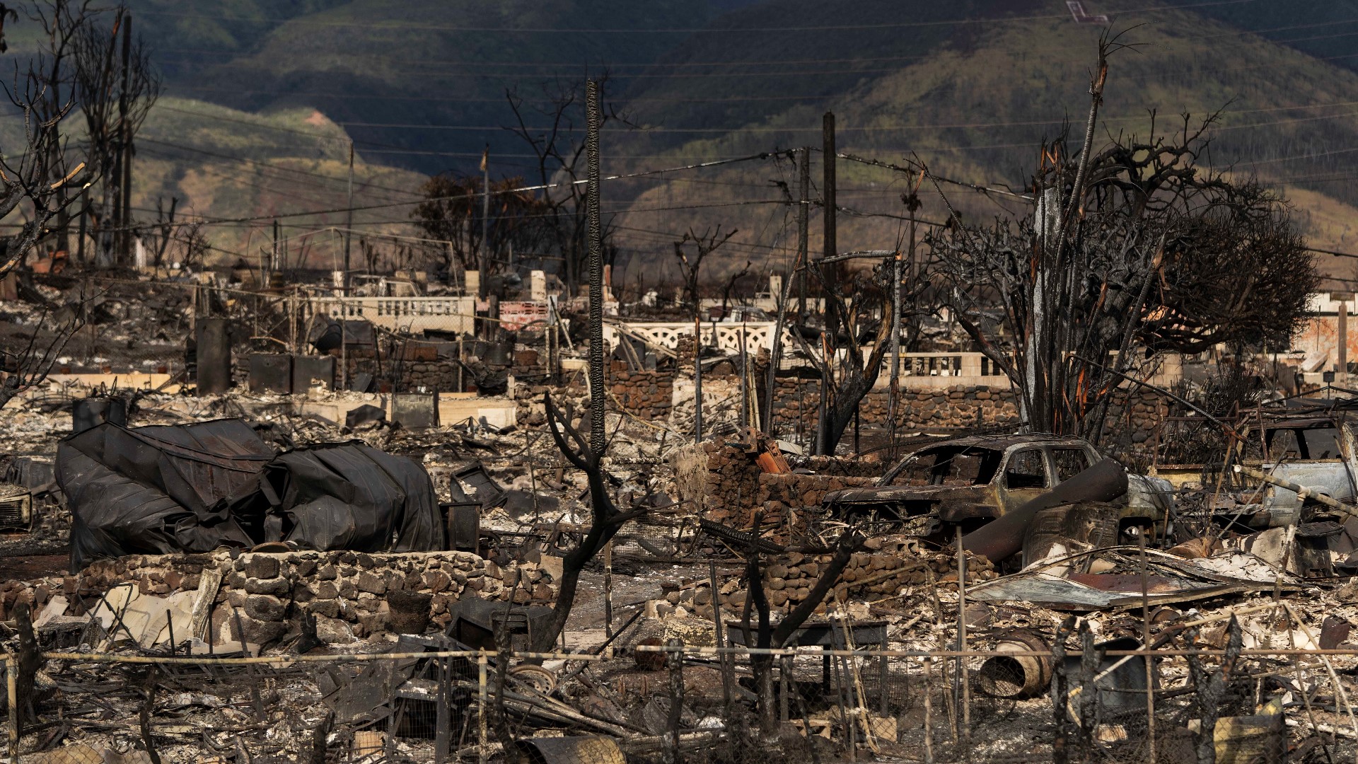 As flames tore through a West Maui neighborhood in Hawaii, fleeing residents headed for the only paved road out of town in a dash for safety.