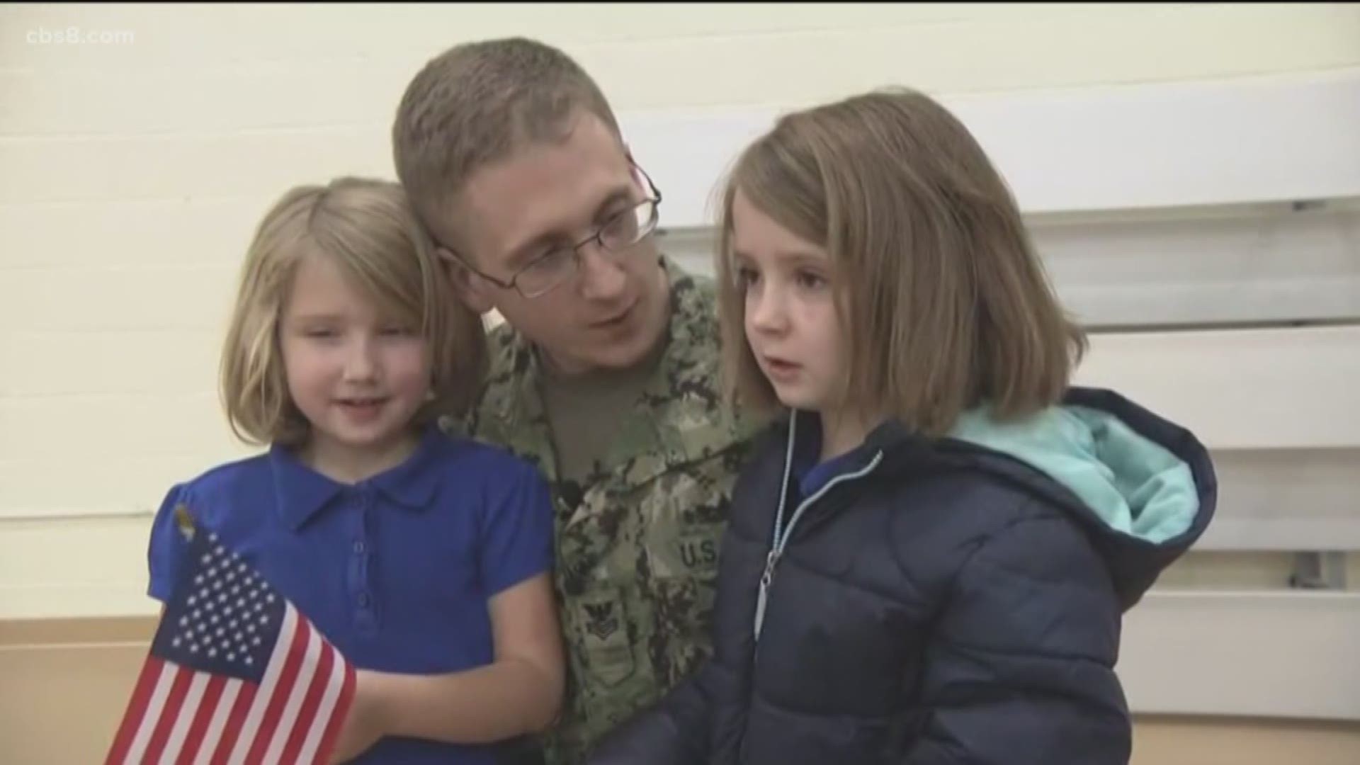 A U.S. Navy sailor returned from deployment on Tuesday and surprised his two daughters at their school.