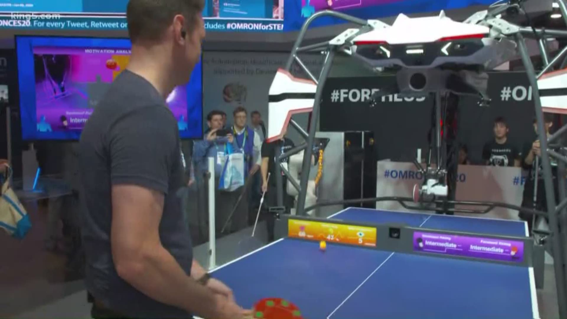 KING 5's Chris Cashman takes on a robot in ping pong. The robot also analyzes moods and movements to offer tips for improvements.