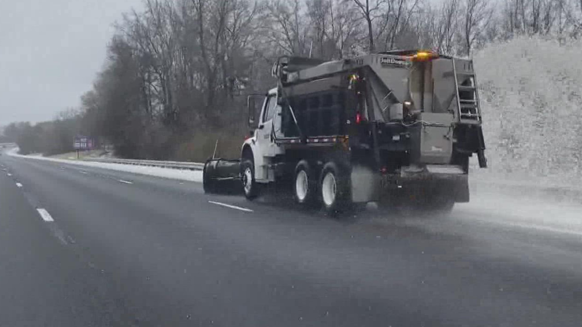 Crews hit the street near Fort Mill, South Carolina in York County to clear away ice and sleet from Sunday's winter storm.