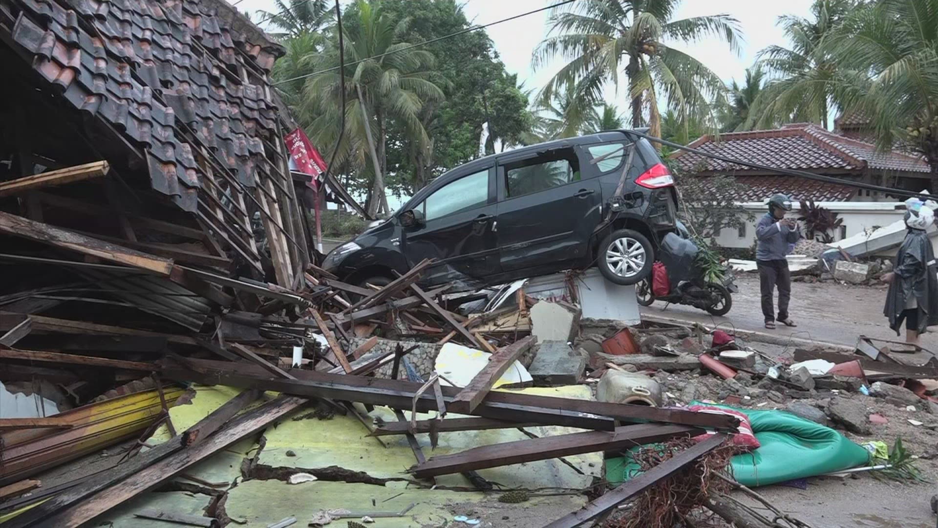 Wrecked homes smashed vehicles after tsunami hits Indonesia