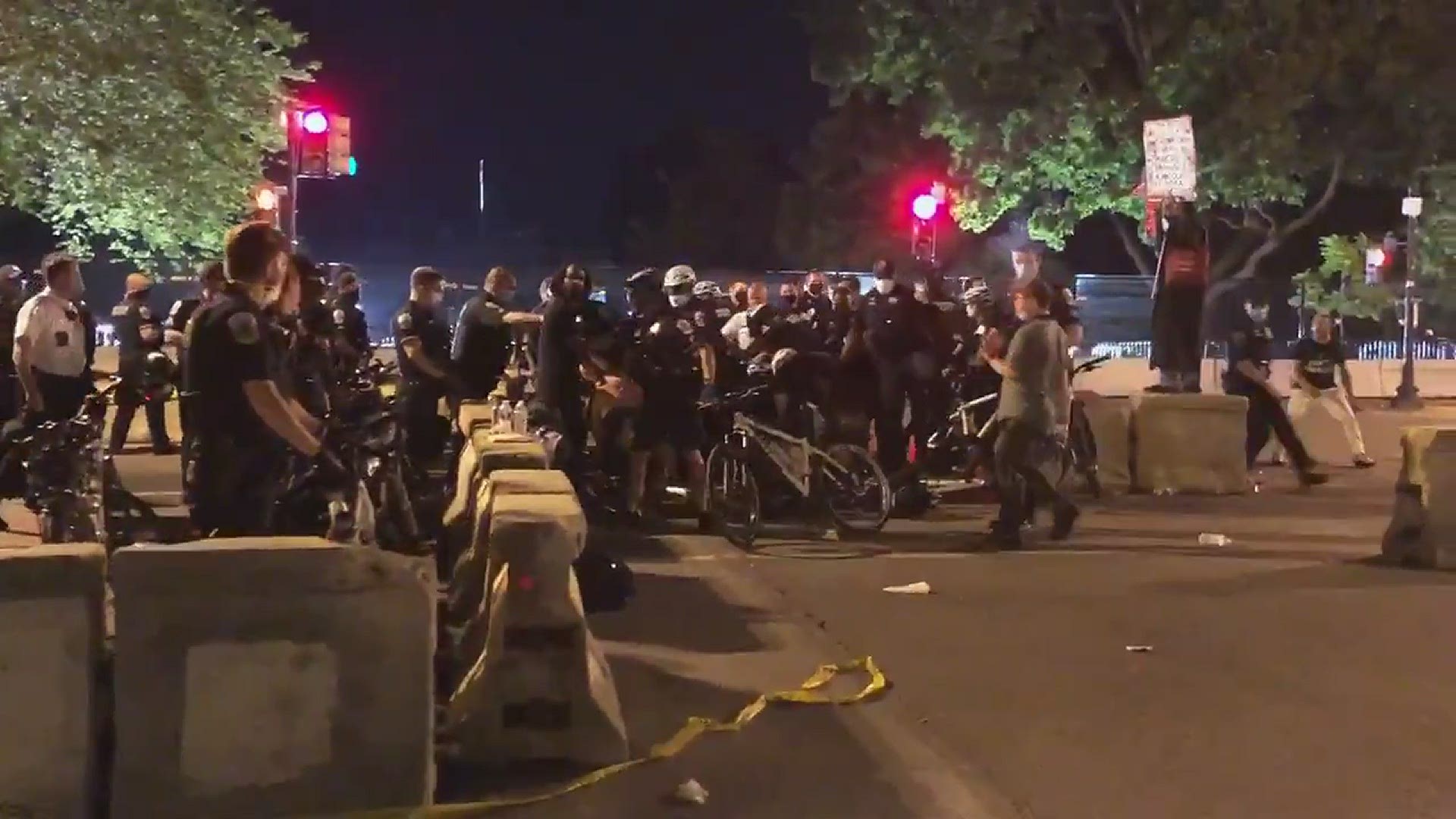 Protesters and police clashed at BLM Plaza near a new fence that was put up around St. John's Church. One woman was forcibly pushed to the ground by police officers.