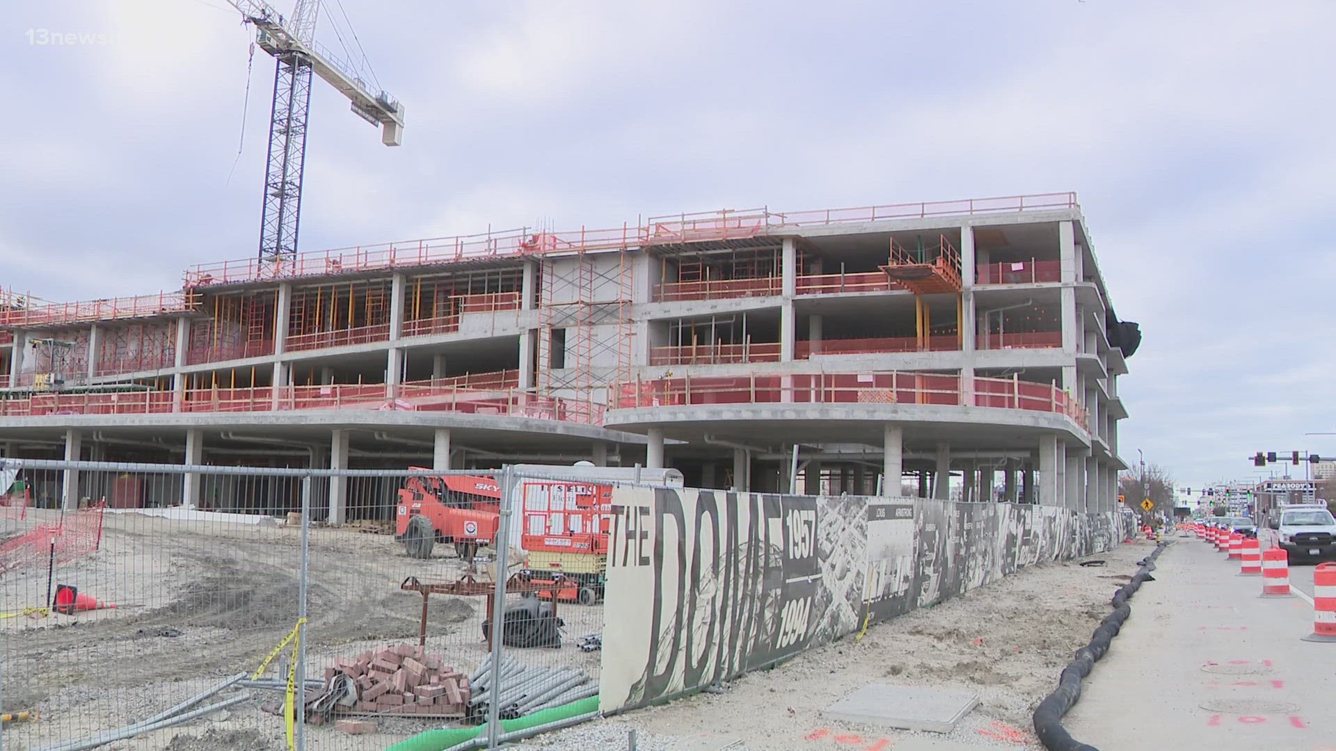 Three tall cranes now sit above the 12-acre site. Passersby can clearly see what will become the 3,500-seat entertainment venue, parking garage and wave park.