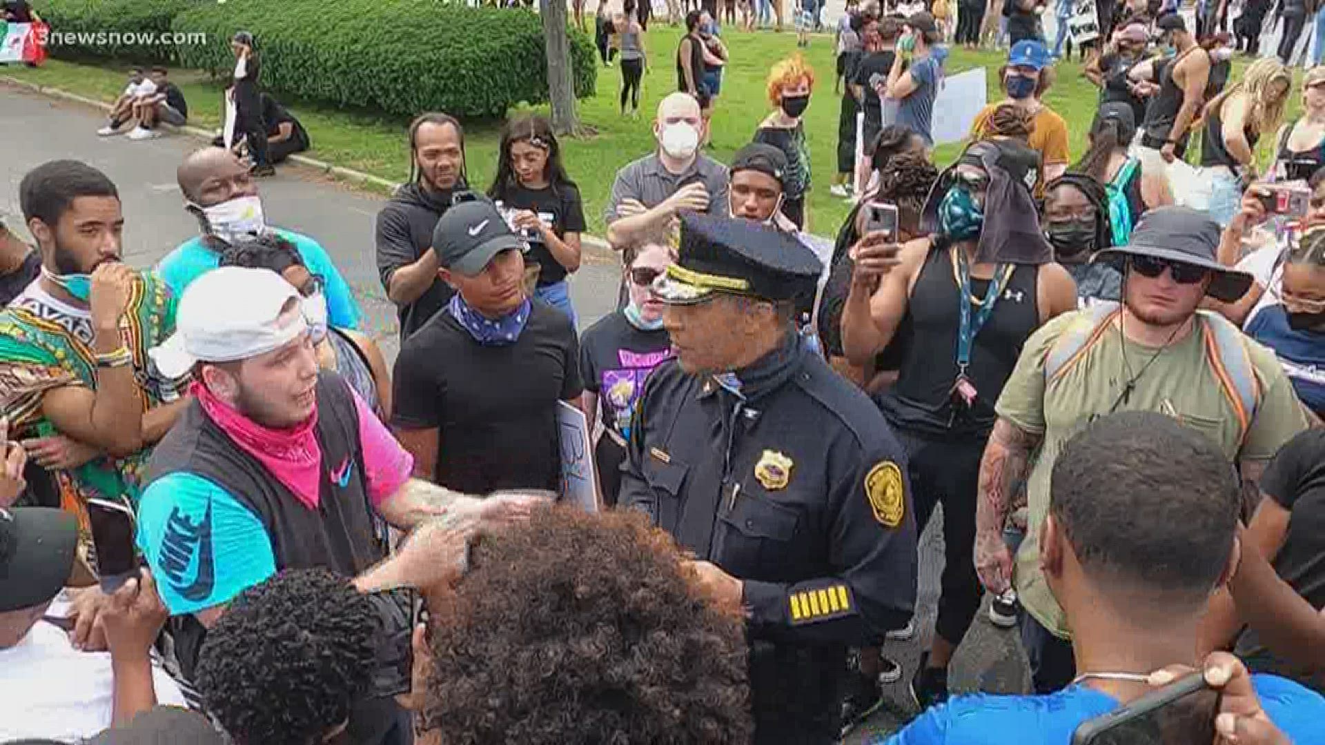 Norfolk Police Chief Larry Boone held a sign that said "Black LIves Matter" as he mixed with the crowd calling for justice after the death of George Floyd.