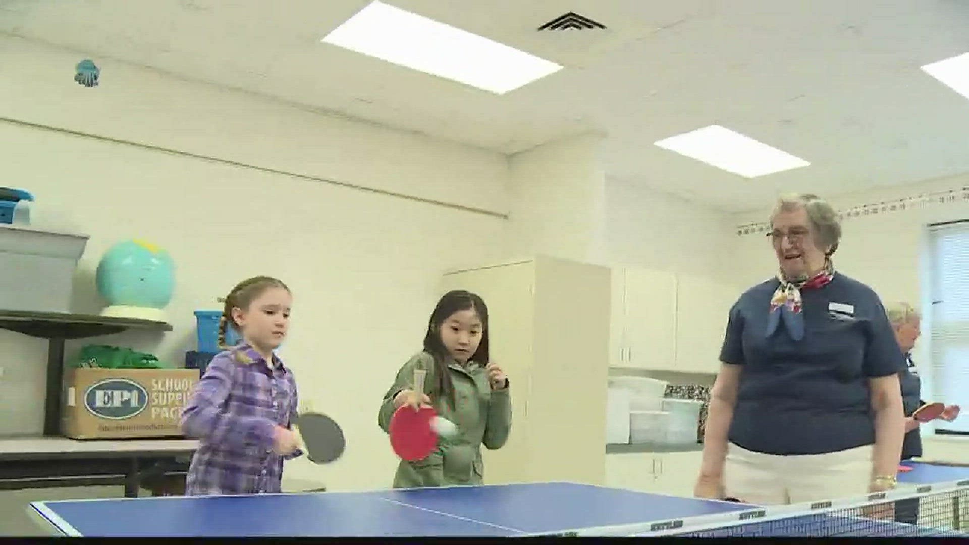 Retirement community teaches ping pong to kids