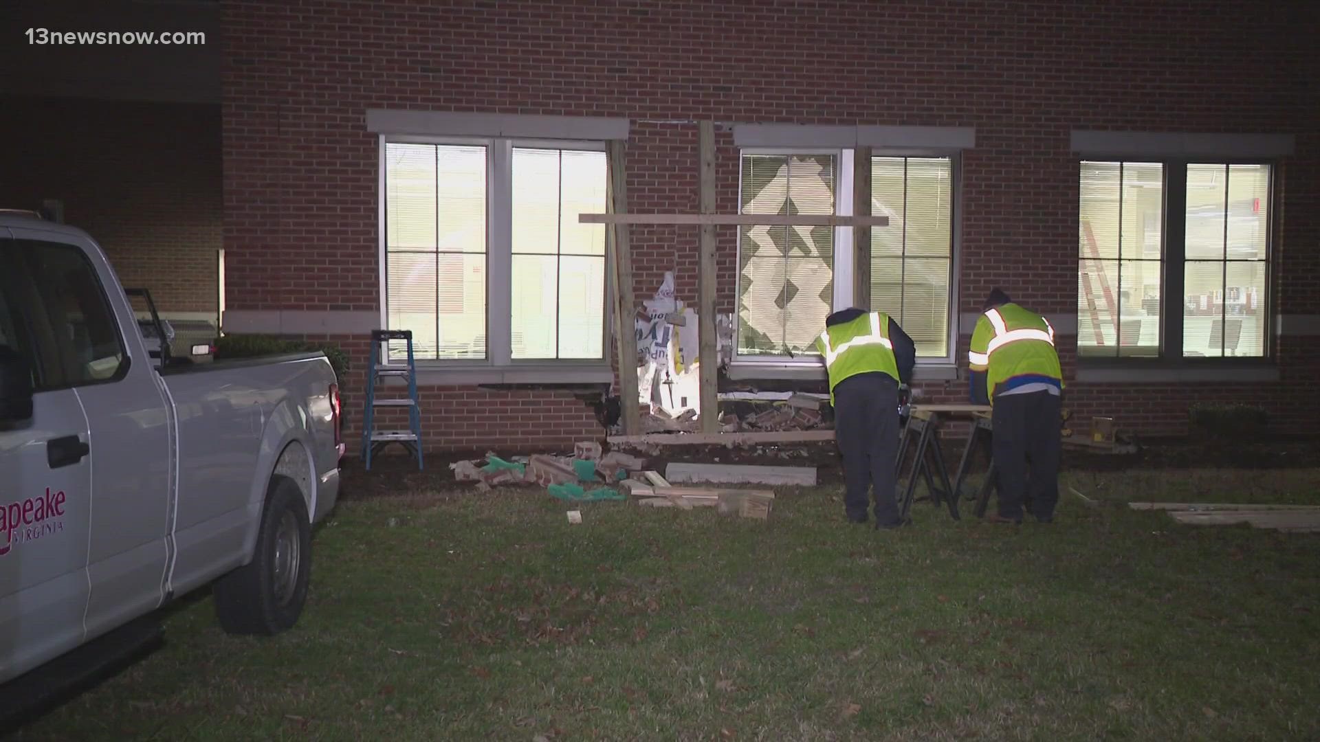 After a crash with a truck, an SUV went off the road and struck Indian River Library. Two people were taken to the hospital.