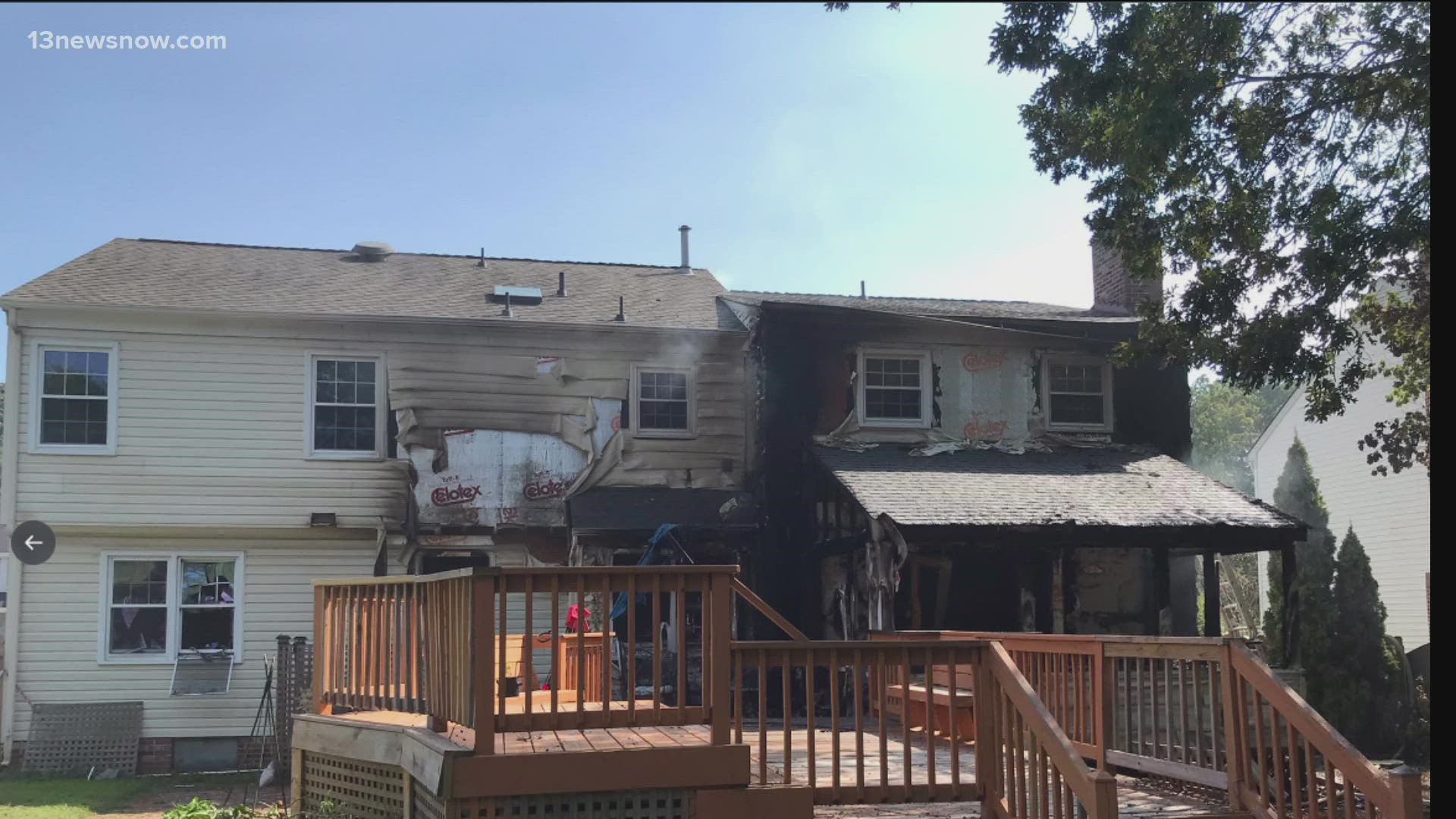 Photos provided by the division show the house badly charred on the backside near the deck. No one was hurt, though.