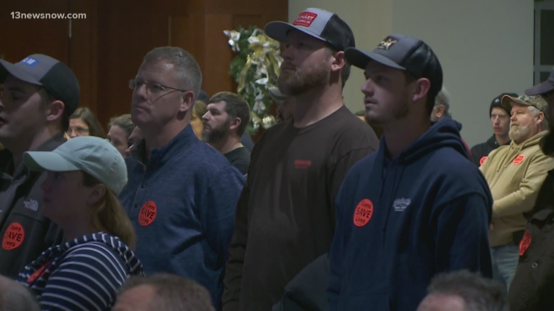 Nearly 600 people gathered at the Suffolk City Council meeting to support the city becoming a Second Amendment Sanctuary. They wore 'Guns SAVE Lives' stickers.