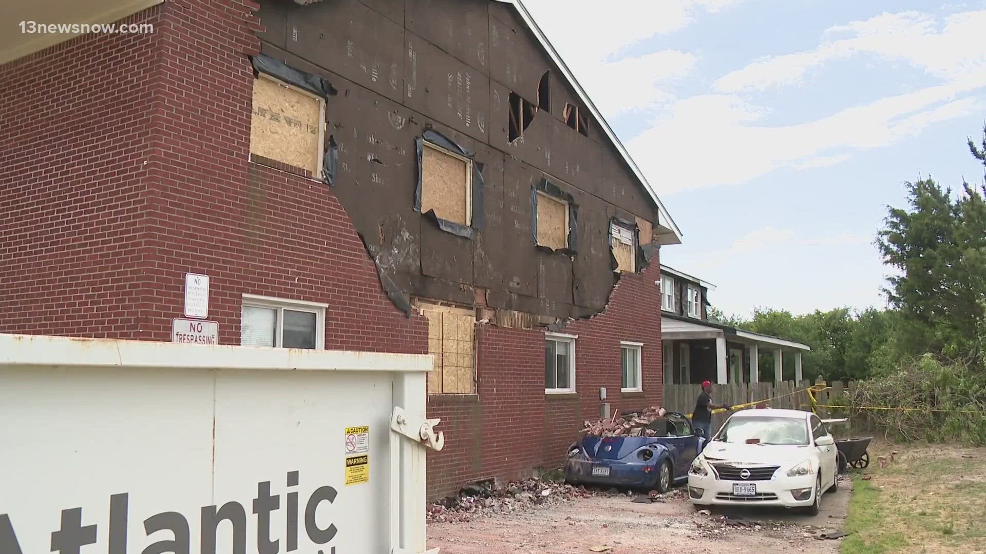 Apt. building's brick facade wall damaged by storm in Ocean View