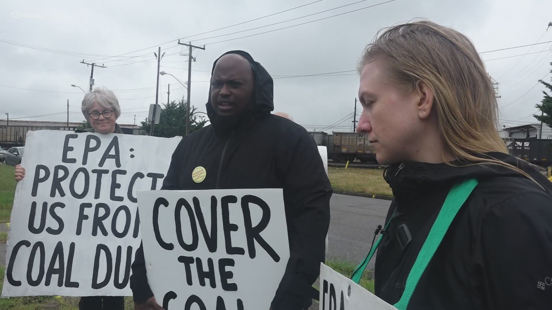 A handful of people stood outside Norfolk Southern Railway, demanding company leaders do more to protect people from coal dust.