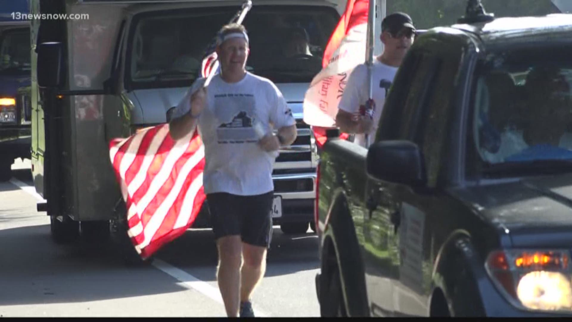 Runners stop at about every mile for a ceremony to read out names of the about 20,000 fallen service members since the bombing of USS Cole 18 years ago.