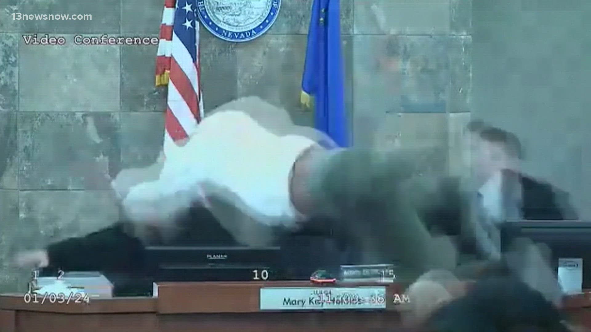 In a violent scene captured by courtroom video, the man leaped over a table and the judge's bench, sparking a brawl.