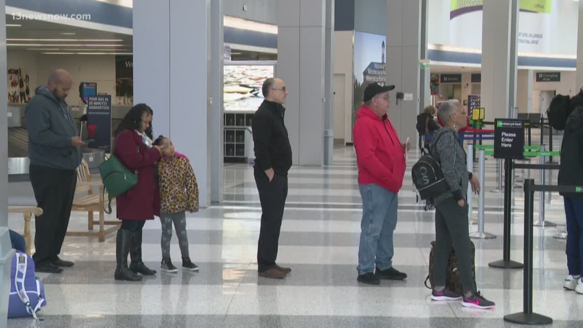 While the crowds were a bit smaller than at other airports, travelers were still waiting at security to get to their gates for their holiday travel plans.