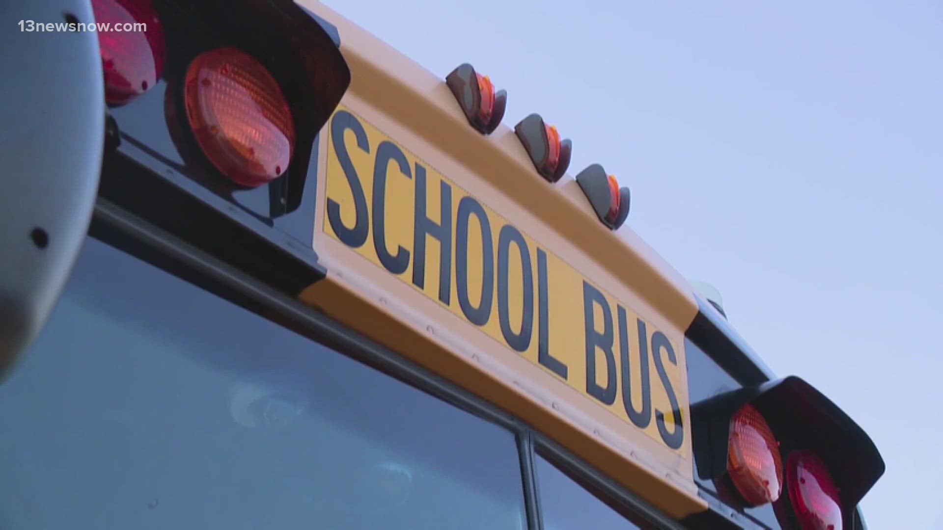 Two people face up to a year in prison after police say they pointed a gun at a school bus driver loading children onto the bus.