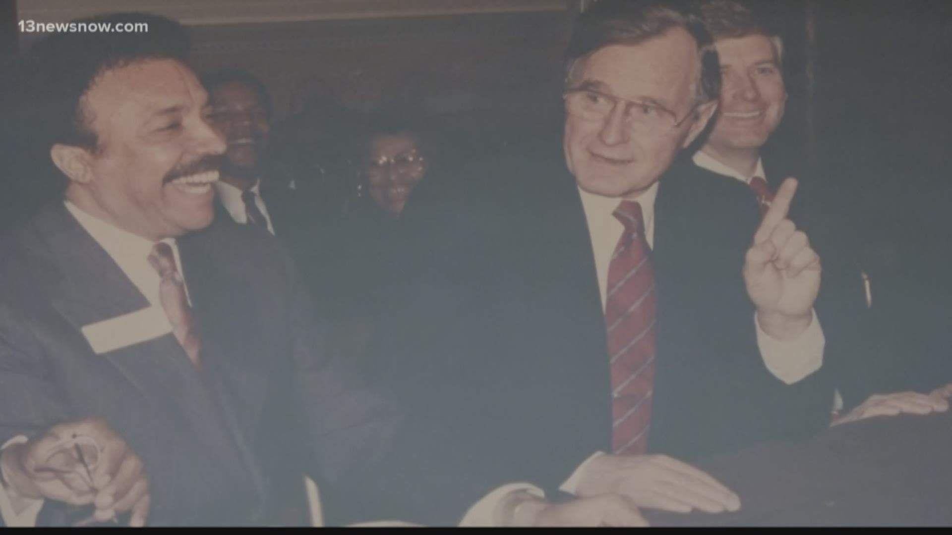 The President of Hampton University had a working relationship with President George H.W. Bush.