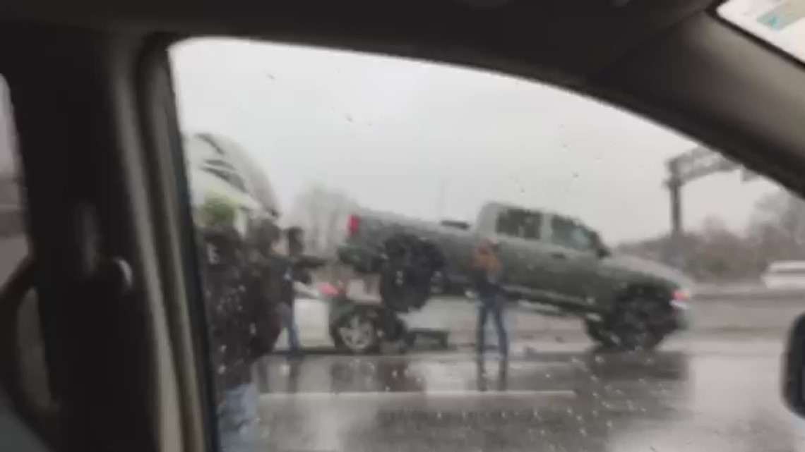 Car drives under truck pulling camper in Virginia Beach 