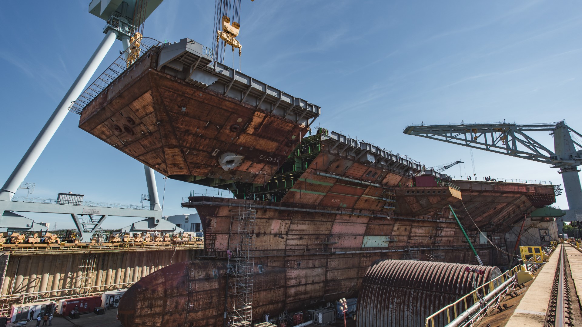 7/10/19: The 780-ton upper bow unit is lowered into the dry dock and placed on the aircraft carrier John F. Kennedy (CVN 79).