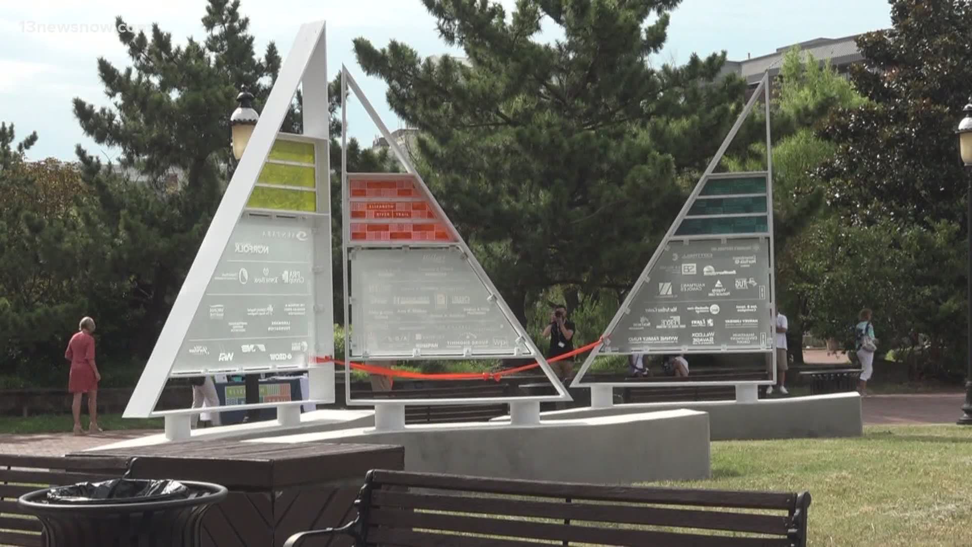 A huge, new sculpture now stands along the Elizabeth River Trail. It features three free-standing sails made of glass and steel.