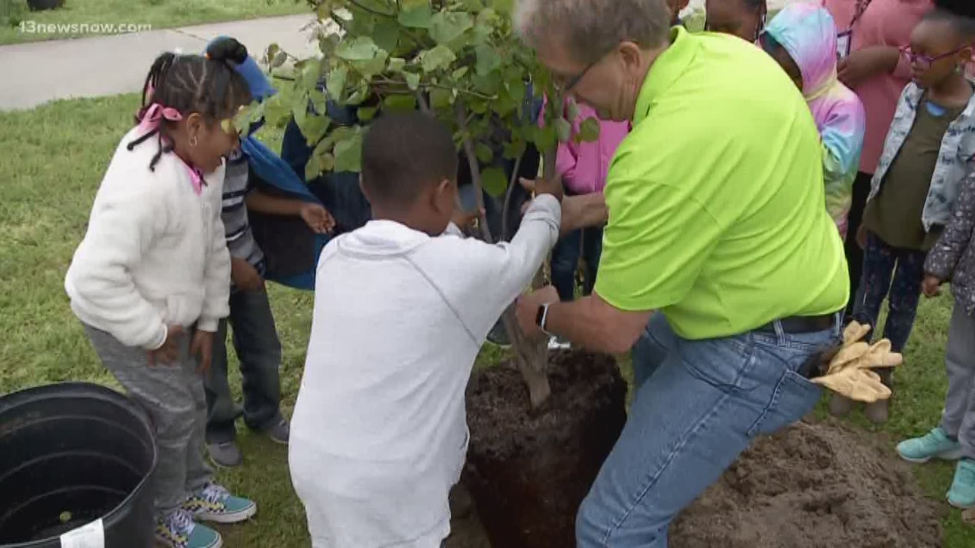 Four trees were planted at John Tyler Elementary School by the first-graders with Dominion Energy as part of "Project Plant It!"