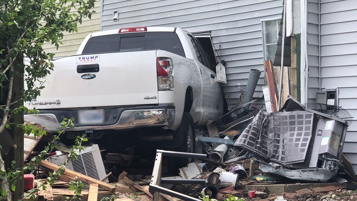 Truck driver hospitalized after crashing into townhomes in Virginia ...