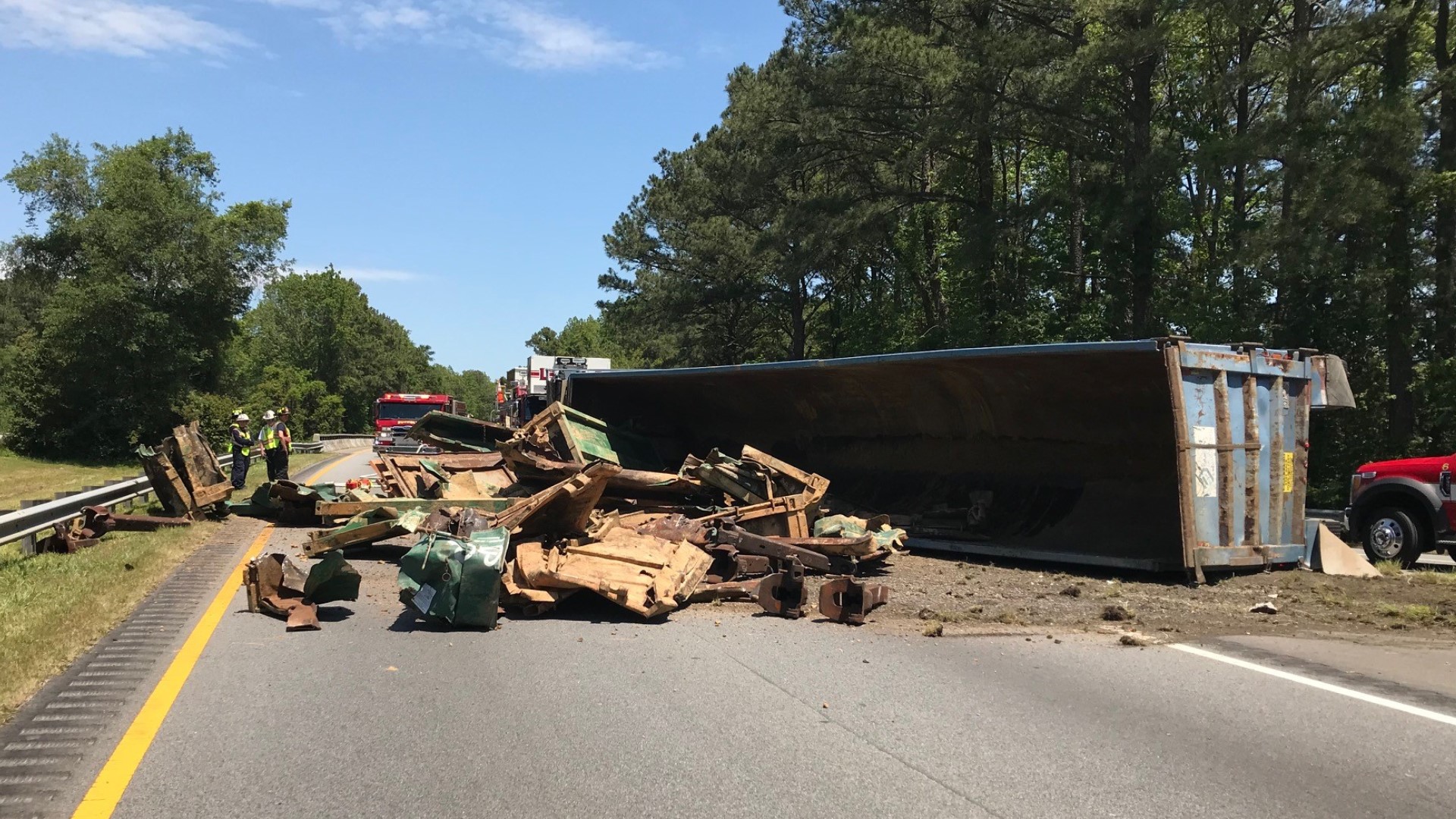 Overturned tractor trailer temporarily shuts down Route 58 in Suffolk ...