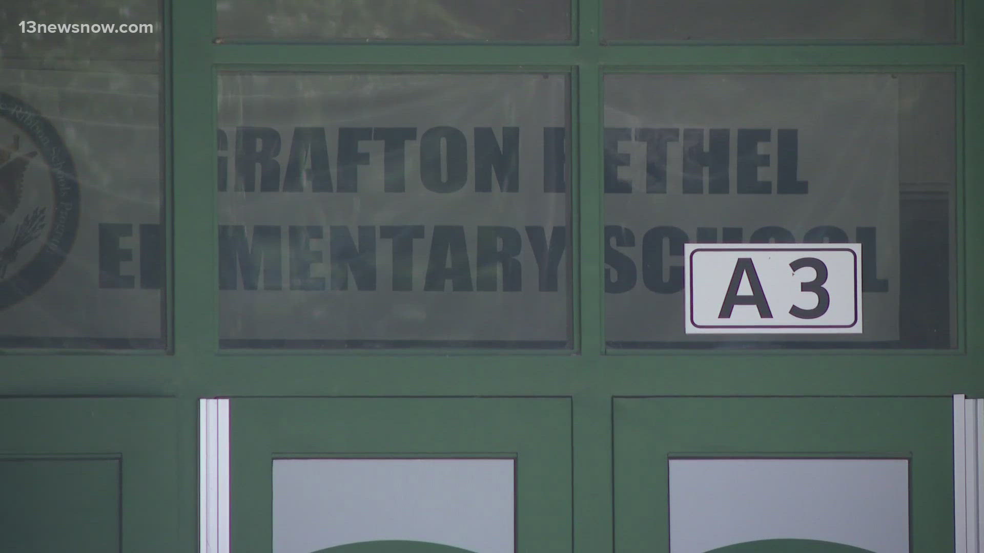 Authorities say Grafton Bethel Elementary School was temporarily under a "precautionary modified lockdown" Friday because of a phone threat.