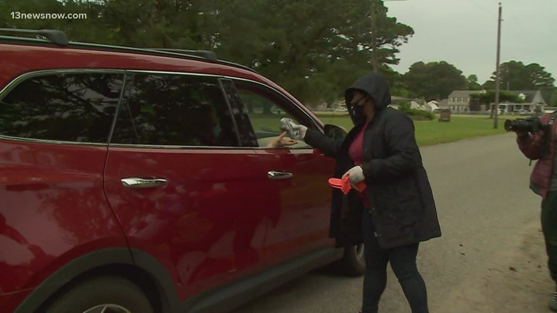 Community members pulled together in Hampton on Monday to pass out washable face masks and hand sanitizer to people who needed them.