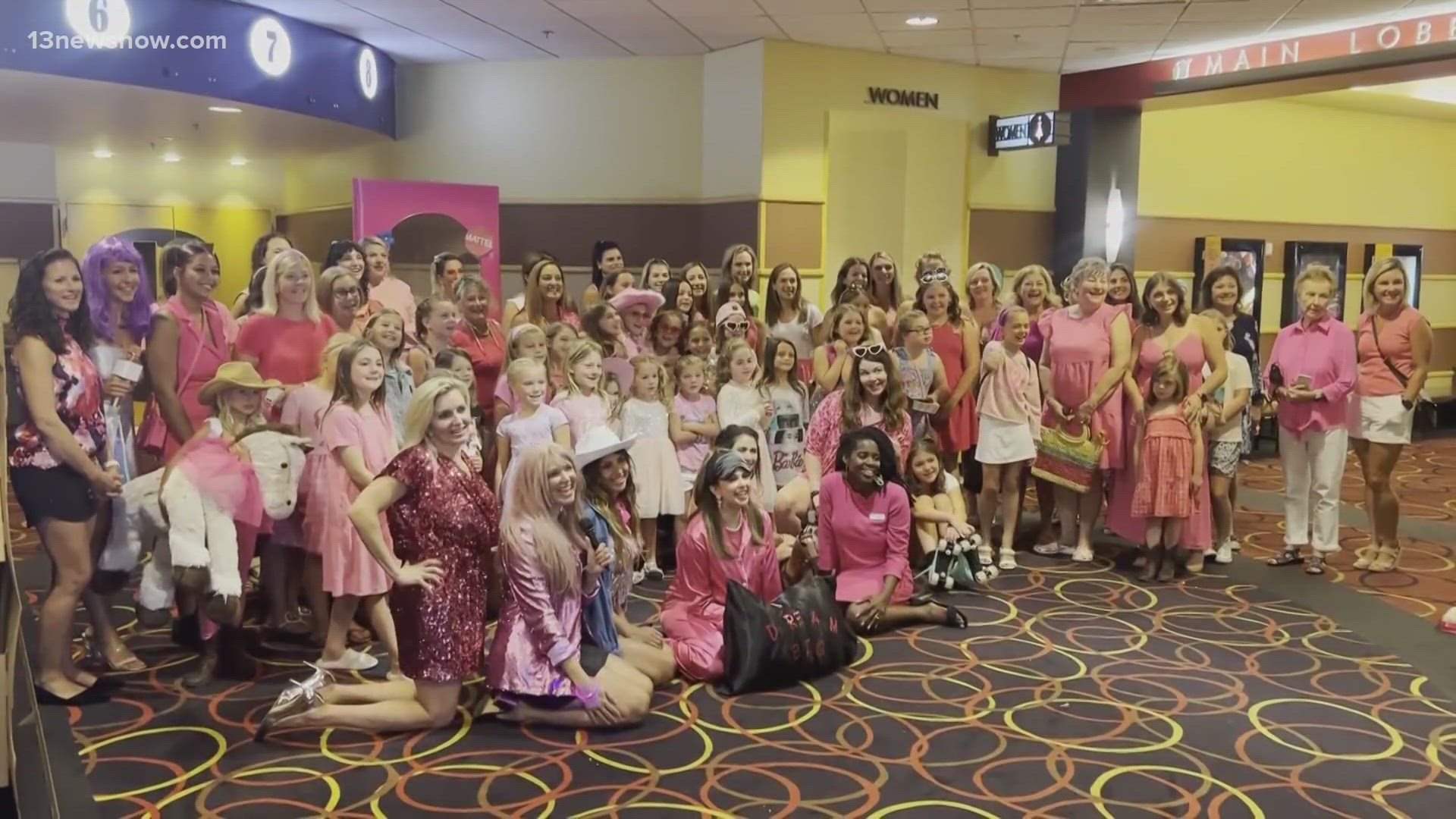 Dozens of girls and women dressed up in pink to see the new movie at AMC Lynnhaven in Virginia Beach.