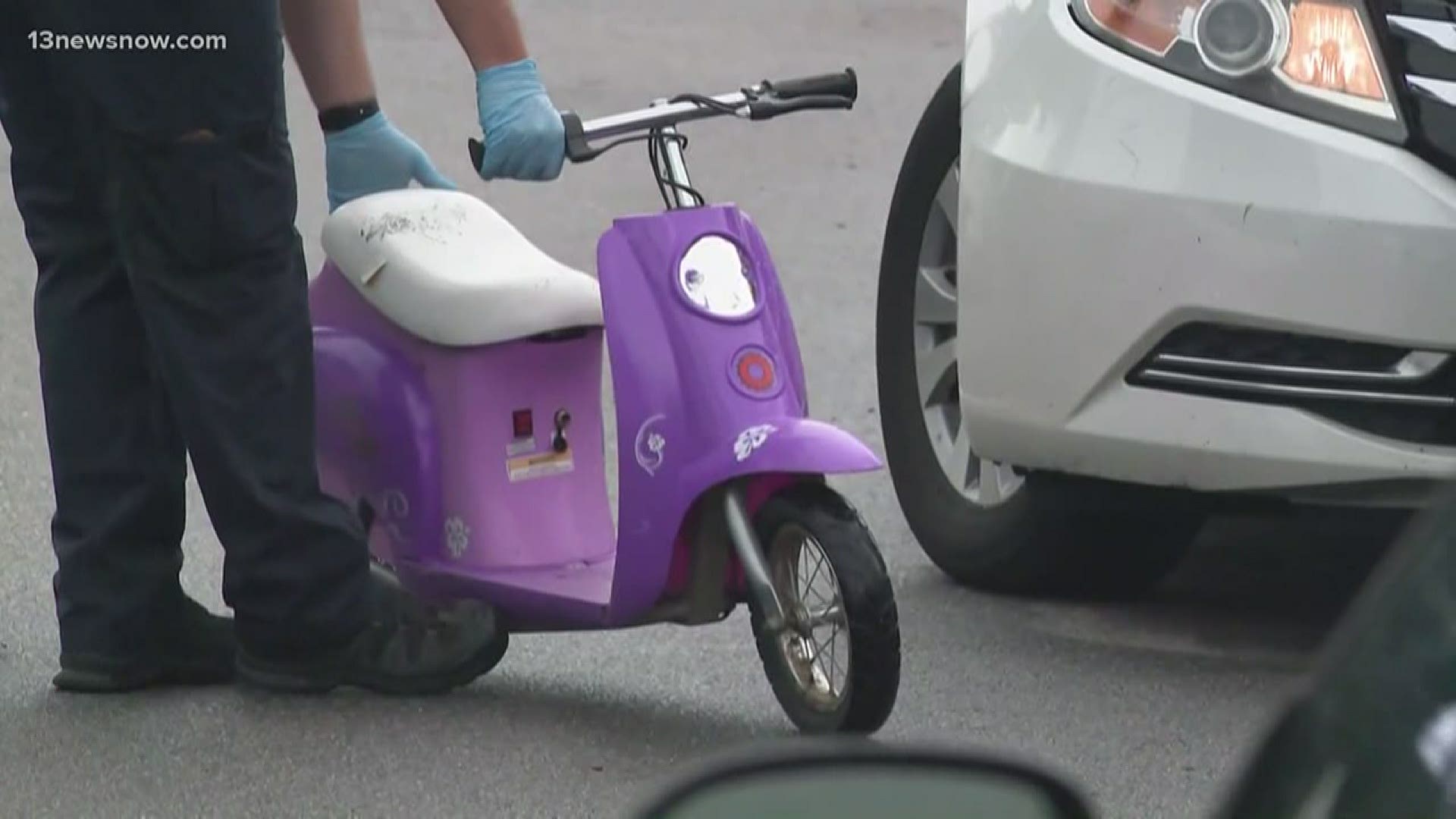 The 7-year-old was playing on a scooter when she was hit by a car and had to be airlifted to a hospital. Her aunt said the girl's father was outside when she was hit