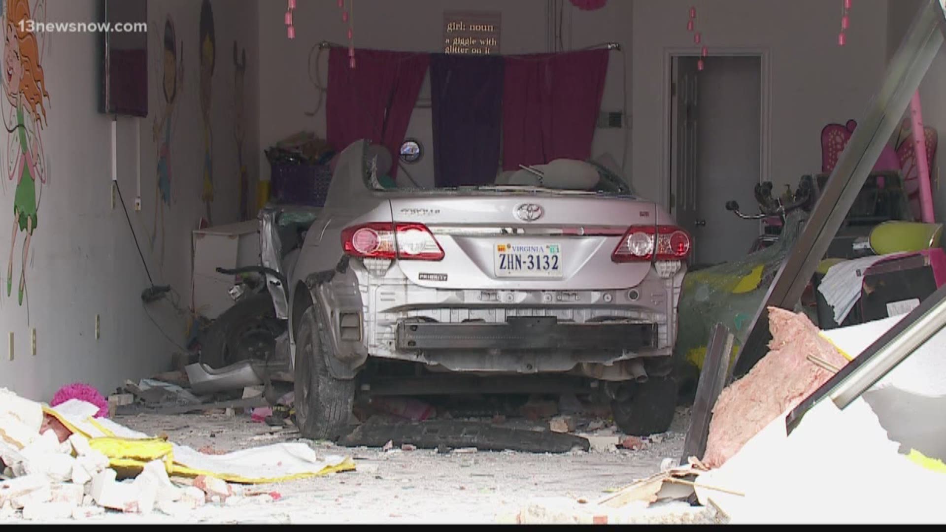 A Virginia Beach business, centered around children, was destroyed this afternoon when a woman drove a car through the front door.