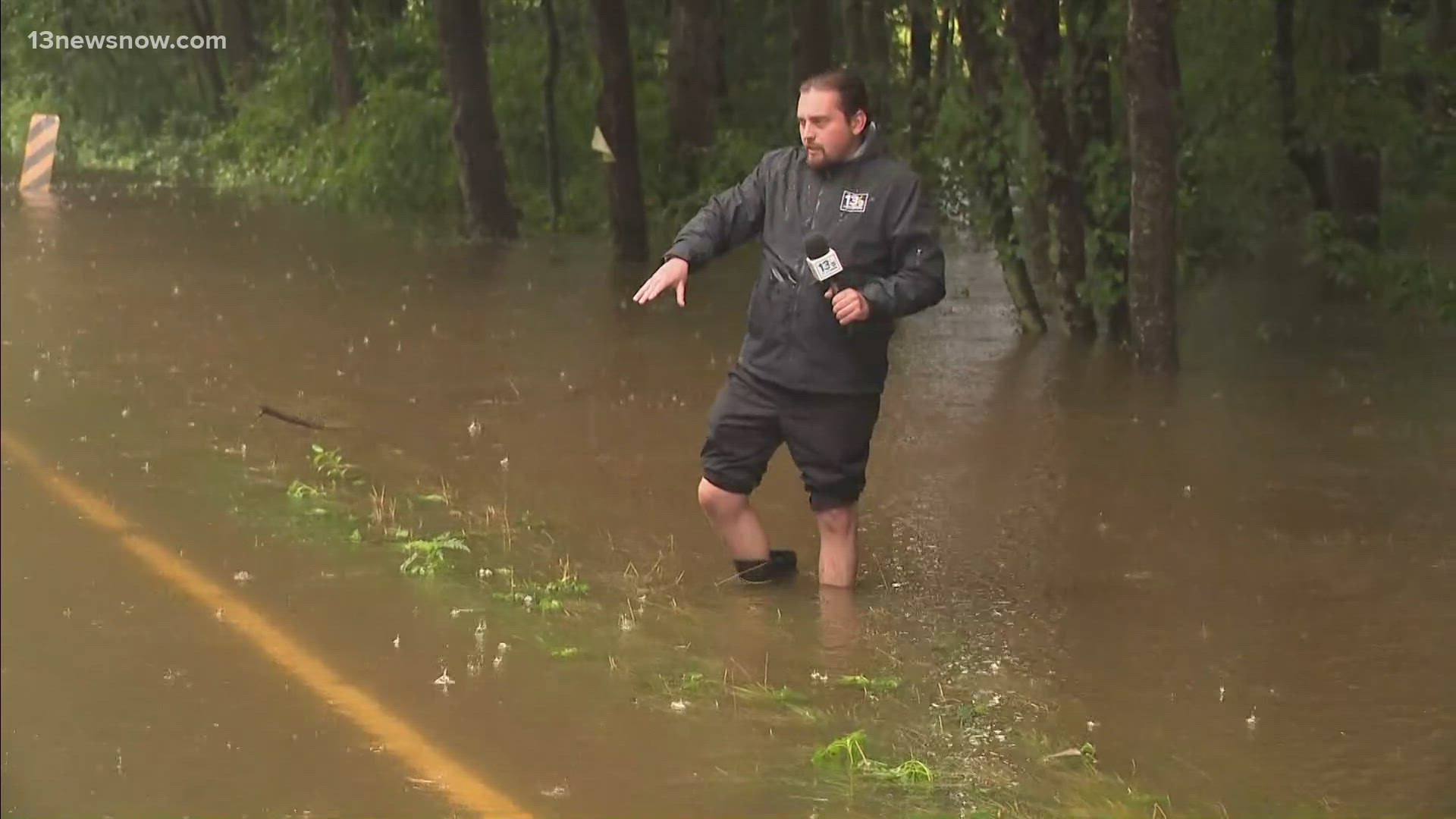 Derek Lytle is outside of Waverly near impassable roads after floodwaters sweep through.