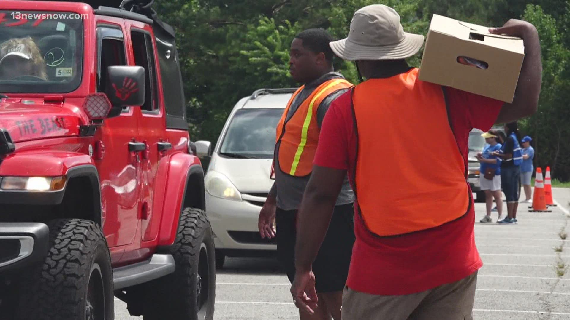 More than 1,400 people showed up at the drive-thru food pantry. Workers and volunteers packed cars full of fresh fruit and vegetables, cereal, and milk.