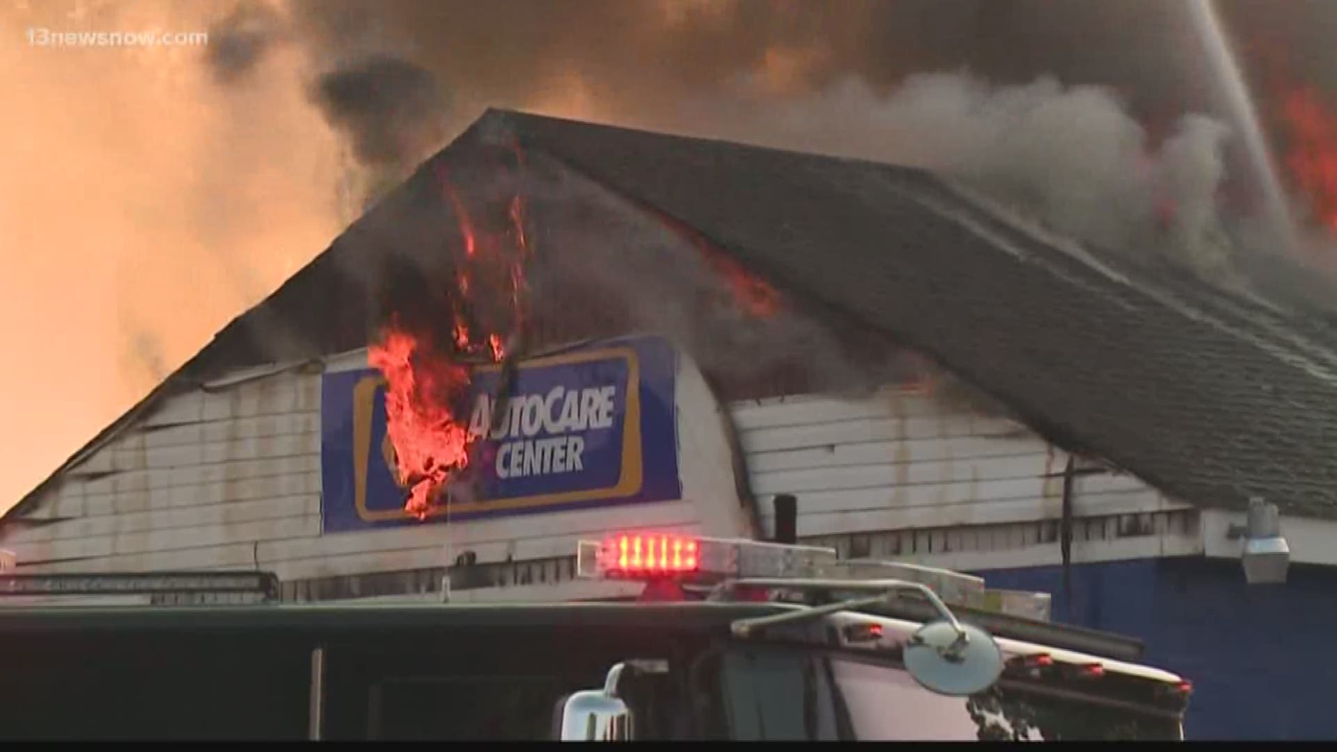 A fire burned through the roof of a NAPA AutoCare Center in Portsmouth on Tuesday morning.