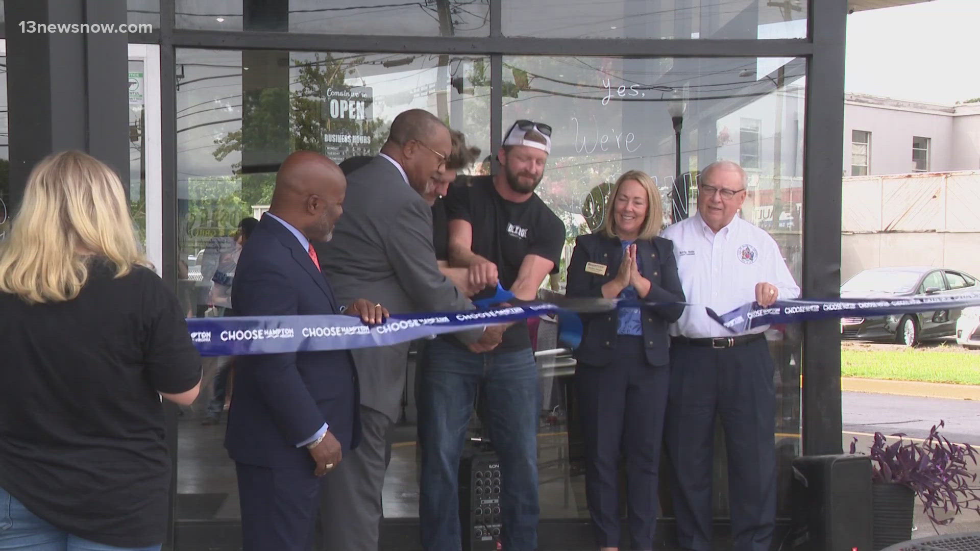 In Hampton on Tuesday, a new coffee shop held its grand opening less than two days after vandals hit the shop's building next door.