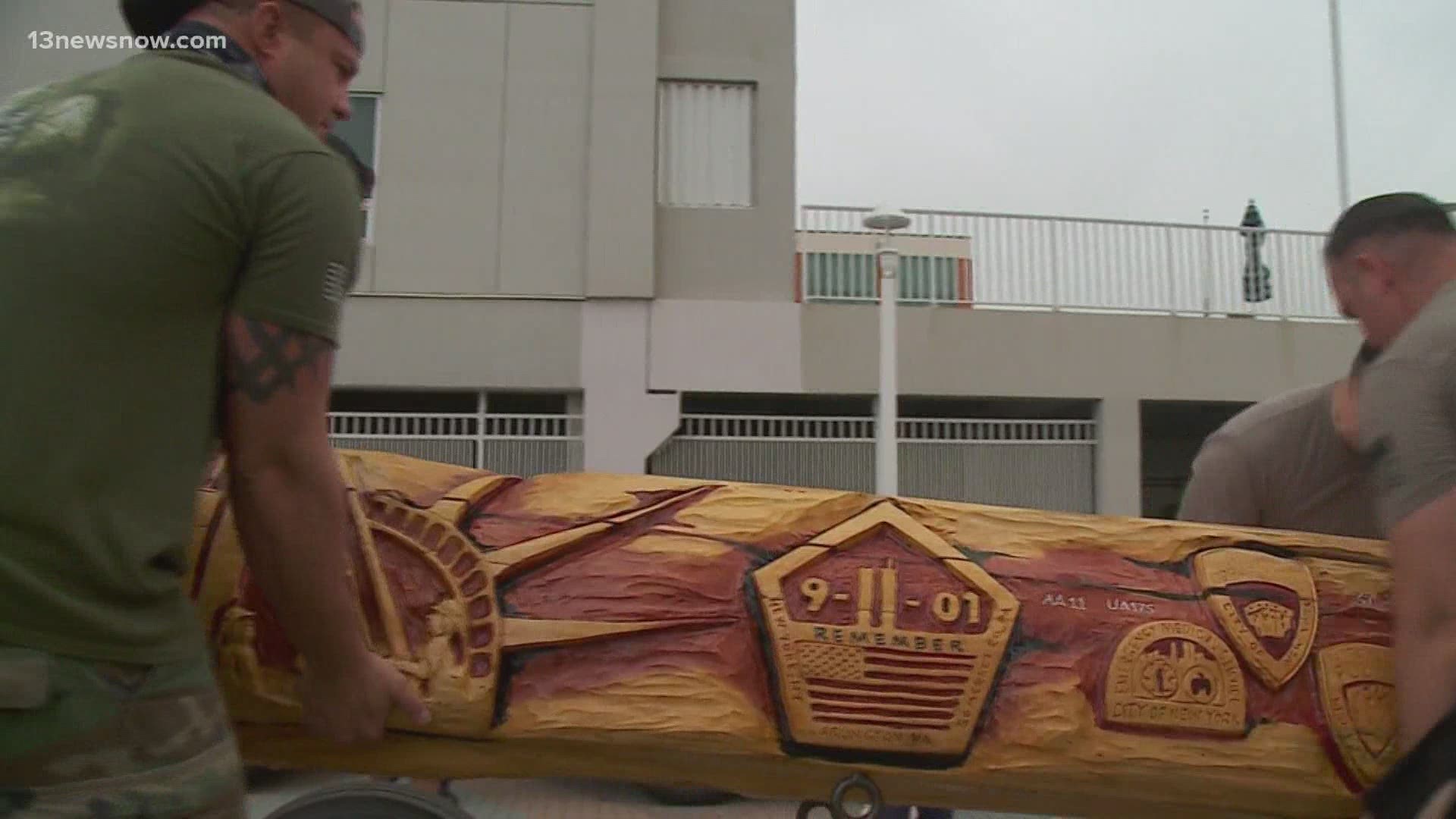 The 700-lb log features several designs to commemorate the lives lost in the 9/11 terror attacks.