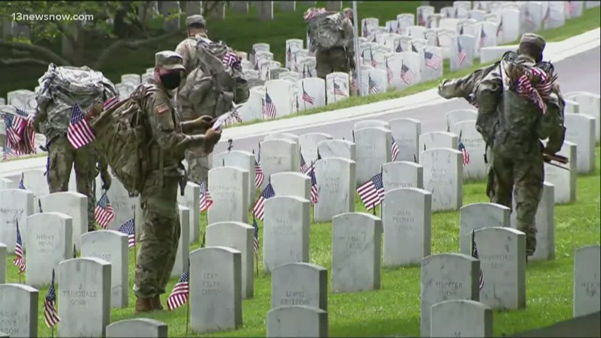 Soldiers spend the day putting American flags at Arlington National Cemetery