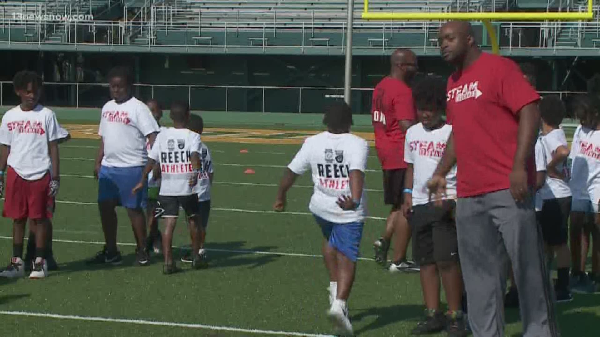 Lions safety Don Carey runs football camp