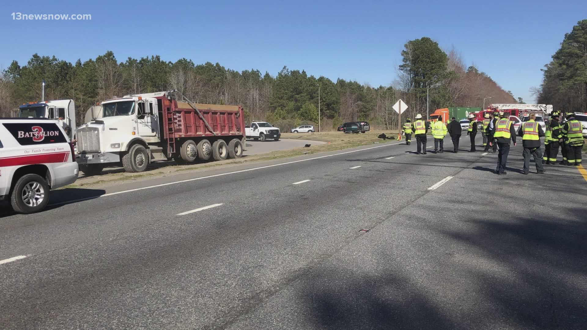 Three people were hurt after a crash involving three cars and a dump truck in Suffolk. One man was badly hurt.